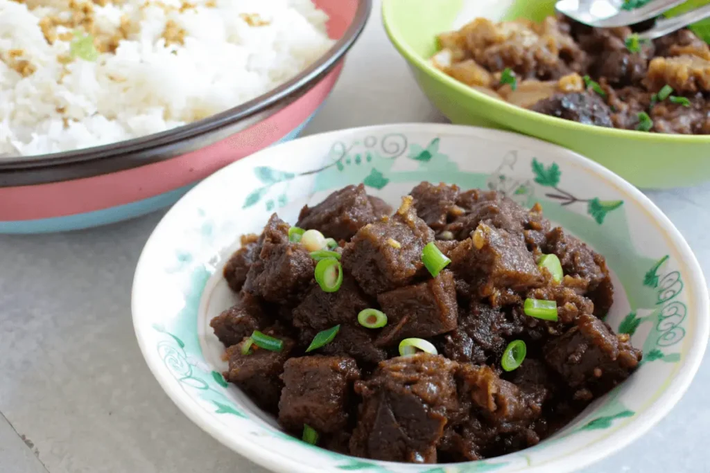 A plate of authentic beef pares served with garlic fried rice and beef broth.
