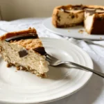 A creamy mascarpone cheesecake garnished with fresh berries.
